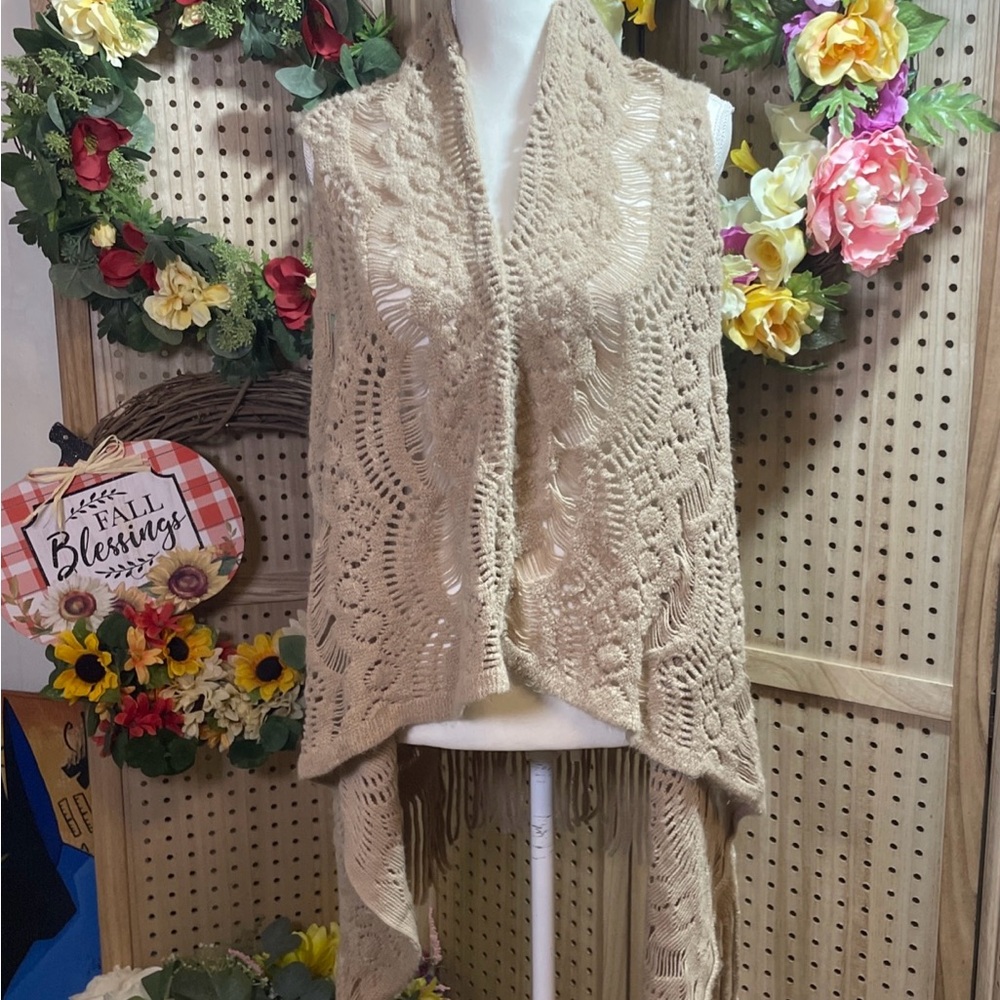 Crocheted shawl vest.